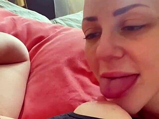 She teases huge clit while sucking erect nipples
