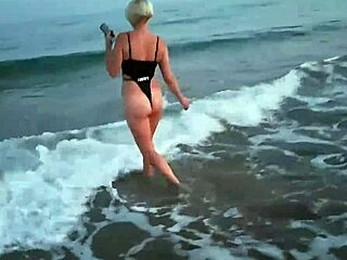 Blonde flashing tits and sucking cock on the beach, so public!