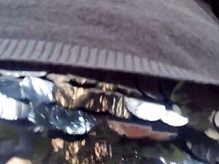 European woman flashes tits in public garden then wets pants