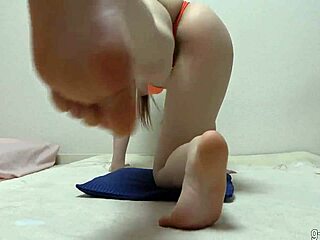 busty japanese girl does yoga in micro bikini showing natural tits and nipples