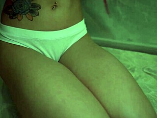I'm the tattooed cutie, uh, sucking lollipop then riding dildo to a powerful orgasm, my small waist and natural tits shaking.