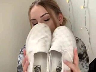 i see the girl removing her sneakers and showing bare feet