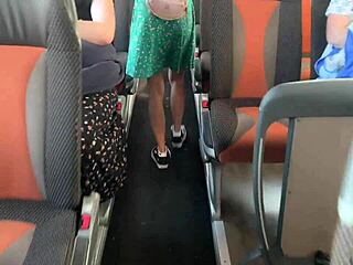In a crowded public bus, the brunette spots the flashing cock and grabs it for a close-up handjob.