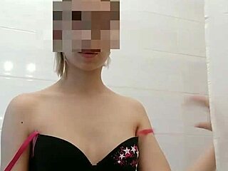 Girlfriend in bathroom teases her small tits.