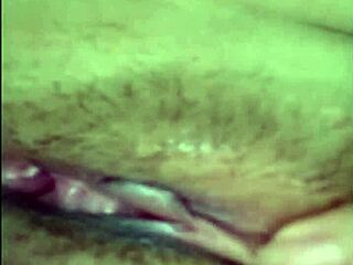 Asian woman spreads legs, uses toy in intriguing video