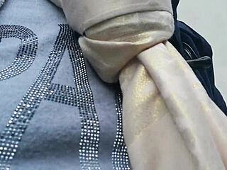 European woman flashes tits in public garden then wets pants