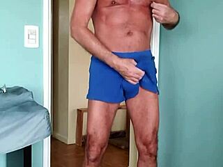 Pervy Papifachero Caresses His Muscular Bodybuilder Daddy Shorts Around the House.