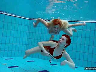 Two hot lesbians enjoy pool underwater