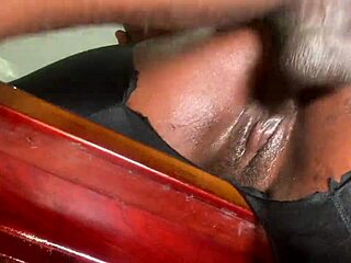 Doggy on the table with muscular hairy bodybuilder bent over desk