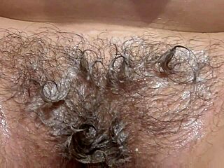 hey, why is this horny brunette in stockings masturbating her hairy pussy with a bottle fetish close up?