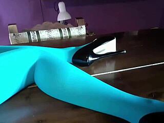 Milf With Beautiful Legs In Pantyhose And Heels Lying Seductively On The Table