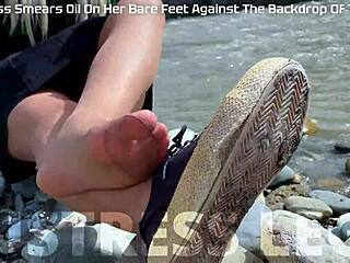 Goddess contrasts tan nylons with cute soles and toes teasing by the riverside outdoors