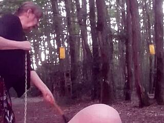Outdoor femdom session with face sitting and wet BDSM play in the forest