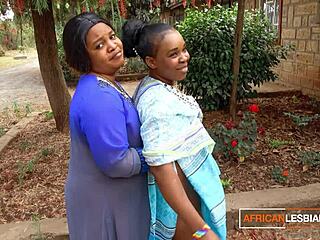 Curvy African milf lesbians share steamy makeout session outdoors at wild house party before wedding chaos.