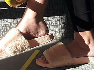 look at this candid shoeplay from a stunning brunette in pink slides on the train