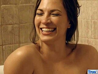 Woman enjoys steamy bath time adventure