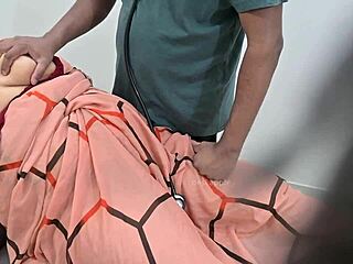 indian doctor examines lady patient closely