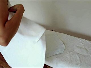 pervert masseur massages skinny brunette while husband waits