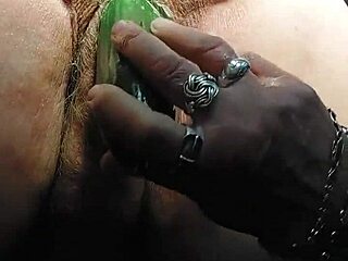 Granny slut fucks hairy pussy with cucumber