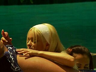 Bisexual milfs lick in outdoor pool threesome