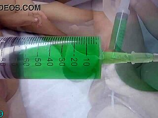 lesbian slides tube into peehole to piss deep in her lover's uterus