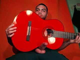 sexy bodybuilder grinds guitar on monster cock