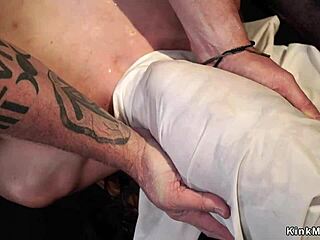 brunette endures intense one-leg bondage suspension