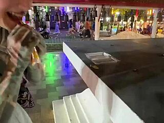A quirky thai lady feeds stray cats in crazy thailand scene