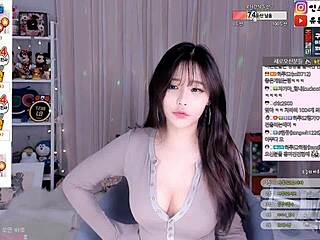 sexy korean babe dances seductively showing off her bouncy natural big tits