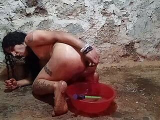 Watch this shemale stuff her ass with a thick pickle