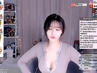 sexy korean babe dances seductively showing off her bouncy natural big tits