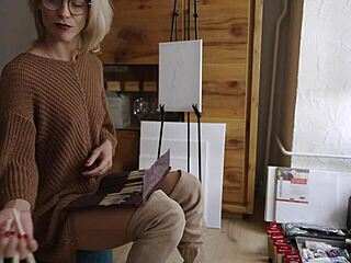 blonde babe in boots and glasses paints her pretty pussy flower softly