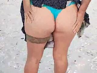 Horny Latina flashes tits and ass on Mexican beach