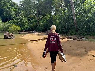 Public beach handjob erupts into homemade sex