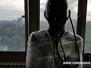 Bound Asian in Latex Catsuit Endures Outdoor Rubber Mummification Play