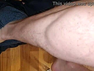 Leather beauty jerks cock to explosive cumshot amid perverse moans and piss