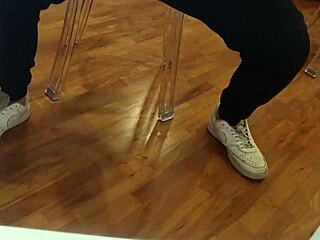 Leather beauty jerks cock to explosive cumshot amid perverse moans and piss