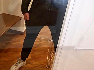 Leather beauty jerks cock to explosive cumshot amid perverse moans and piss