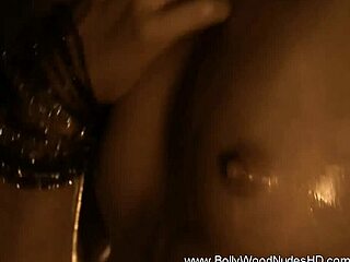 exotic brunette strips nude by sensual fire