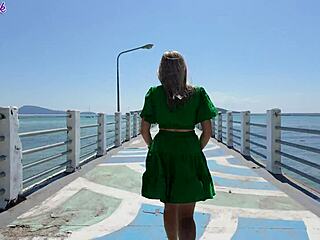 pretty milf teases with remote vibrator on public beach walk