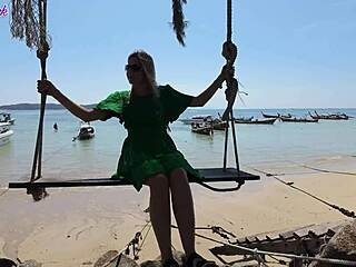 pretty milf teases with remote vibrator on public beach walk