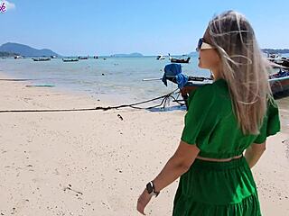 pretty milf teases with remote vibrator on public beach walk