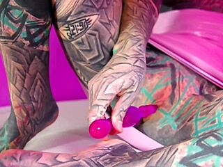 Tattooed beauty fists ass in wild solo play