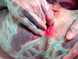 Tattooed beauty fists ass in wild solo play