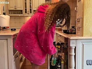 Intriguing bare feet tease from furry slippers in kitchen