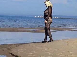 Milf flashes big tits pussy on public beach