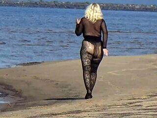 Milf flashes big tits pussy on public beach