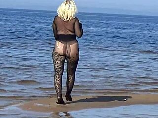 Milf flashes big tits pussy on public beach