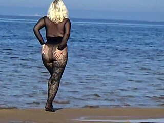 Milf flashes big tits pussy on public beach