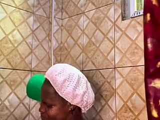 Ebony babe's wet pussy drenched in golden shower